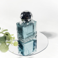 Bouteilles en verre rectangulaires avec couvercles, flacon vide en verre de forme sphérique, atomiseur de parfum, flacon de parfum de luxe 50 ml