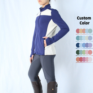 Ropa Ecuestre Personalizada con Dos Bolsillos Laterales con Cremallera, Blusa de Equitación de Manga Larga con Contraste Azul y Blanco y Orificios para los Pulgares - Product Image 3