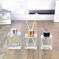 Vente en gros de flacons de parfum vides en verre transparent carrés de 50 ml, 100 ml, 150 ml, 200 ml avec bouchon à vis