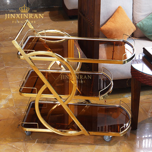 इतालवी आधुनिक लक्जरी गोल्डन स्टेनलेस स्टील रेस्तरां 3 टियर टेम्पर्ड ग्लास चाय की सेवा ट्रॉली - Product Image 3