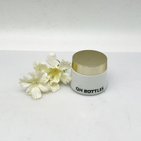 Pot à crème en verre transparent rond et court avec motif en relief et couvercle plaqué or, récipient pour soins du visage