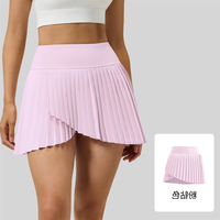 Jupe plissée à effet deux pièces, jupe de tennis et de yoga taille haute anti-exposition avec poches, double couche antidérapante couleur unie