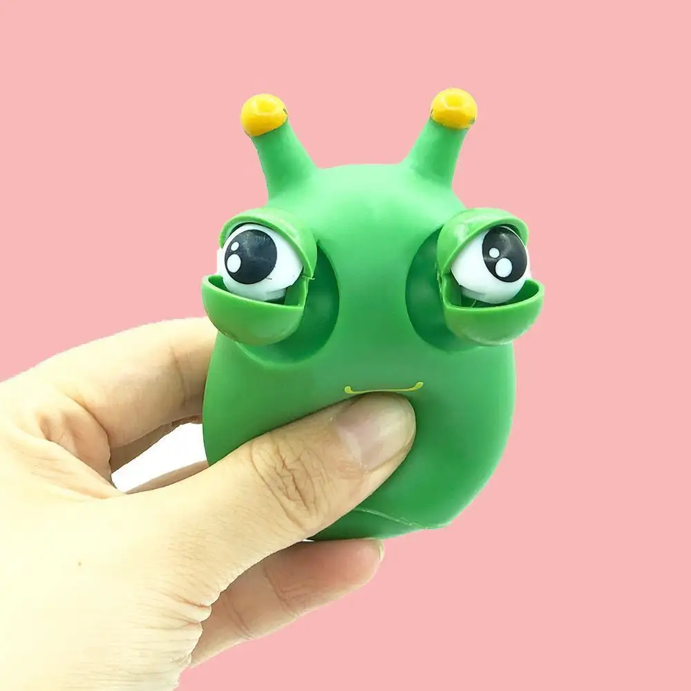 Игрушка-червь с зелеными глазами