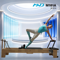 Machine de Pilates MND M101A (2) avec structure en bois de caoutchouc pour revendeurs, équipement de studio de Pilates pour salle de sport commerciale, cadre stable