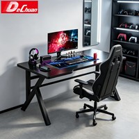 Bureau de jeu en fibre de carbone et métal avec base en acier en forme de X et passe-câbles intégrés