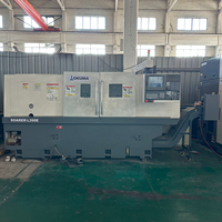 Articles d'occasion de précision ultra-élevée, tour CNC Okuma L390E pour le tournage de pièces d'arbre de moyenne taille et de haute précision.