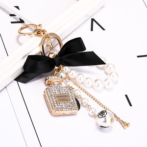 <strong>Mini</strong> <strong>Pink</strong> Bow Keychain <strong>Set</strong> with <strong>Perfume</strong> Style Pendant Luxury <strong>Perfume</strong> Bottle Shaped Pearl Keychain Car Accessories for Women - Product Image 1
