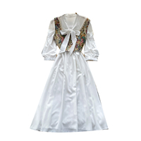 Ensemble élégant vintage 2 pièces pour femme : Robe gilet et jupe mi-longue taille haute à col noué et manches bouffantes, idéal pour les trajets quotidiens en automne
