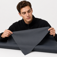 Tissu en peau de pêche tissé sergé avec revêtement en PU imperméable et coupe-vent 100% polyester poids moyen pour manteaux d'extérieur
