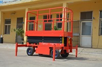 Plateforme de travail élévatrice mobile industrielle en alliage d'aluminium avec ciseaux électriques, pieds stabilisateurs extensibles, hauteur maximale 24m, capacité 100kg