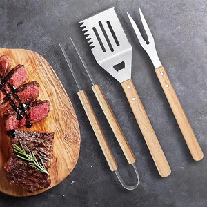 Accesorios Profesionales para Parrilla, Espátula para Cocinar, <span class=keywords><strong>Pinzas</strong></span> para Alimentos, Juego <span class=keywords><strong>de</strong></span> 3 Utensilios <span class=keywords><strong>de</strong></span> Acero Inoxidable para Barbacoa con Mango <span class=keywords><strong>de</strong></span> <span class=keywords><strong>Madera</strong></span> para Exteriores - Product Image 1