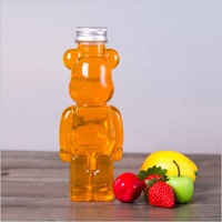 Vente chaude 350ml Bouteille de jus en plastique pour animaux de compagnie en forme d'ours avec bouchon couronne personnalisable pour l'utilisation de boissons au thé et au café