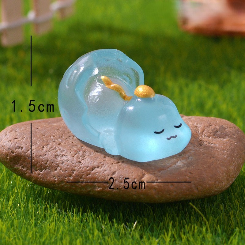 Dinosaure endormi bleu lumineux