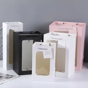 Bolsa grande de papel con logotipo de impresión blanca, embalaje de flores, bolsas de papel de regalo de vidrio con etiqueta colgante de ventana transparente, venta al por mayor