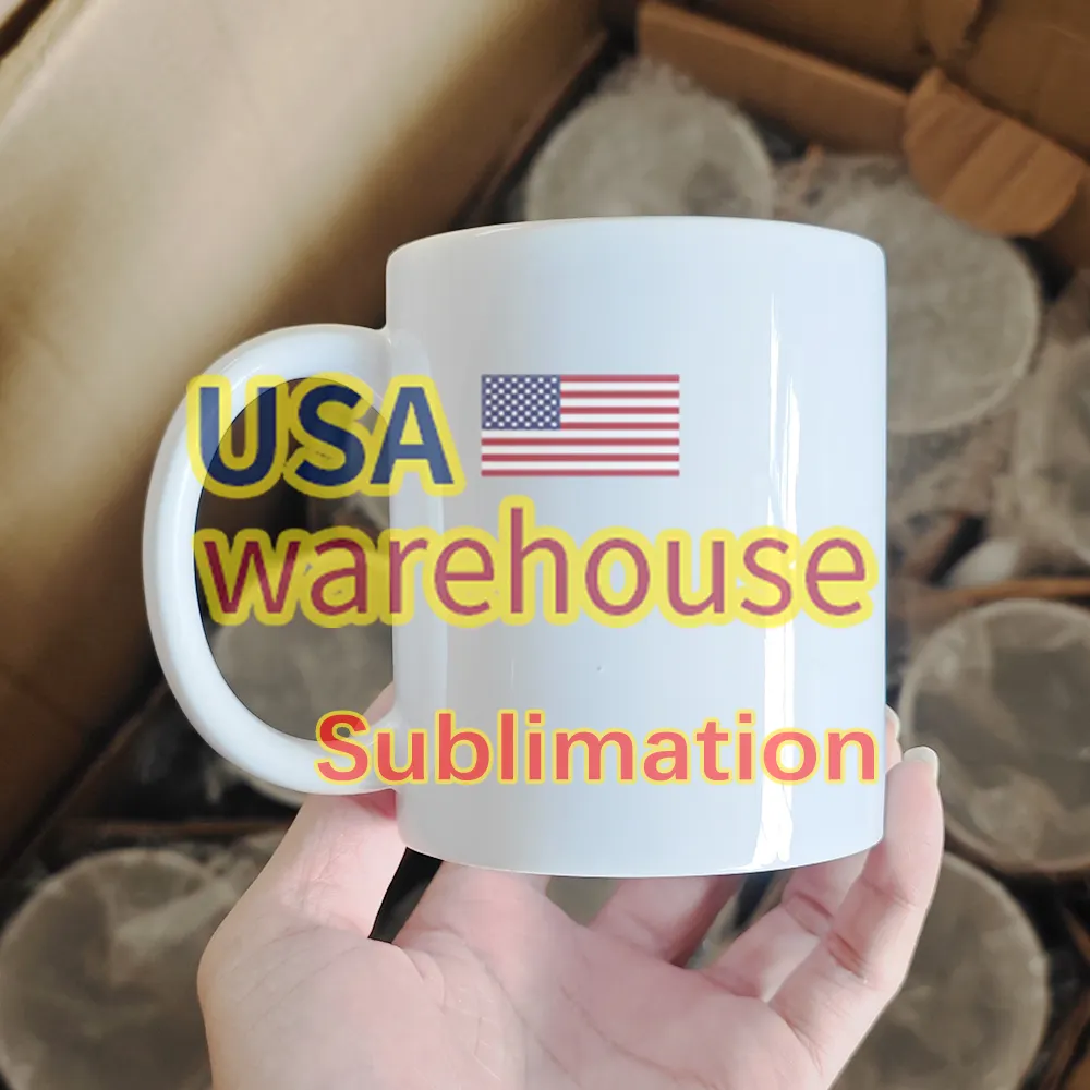 แก้วกาแฟแบบกําหนดเองแก้วระเหิด 11 ออนซ์เปล่า USAE โกดังเซรามิกสีขาว 11 ออนซ์แก้วกาแฟพิมพ์แบบกําหนดเอง