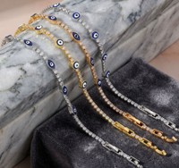 Bracelet géométrique superposé œil bleu, tendance spirituelle, empilable, style statement, succès viral sur TikTok et Instagram, mystère