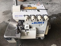 Machine à coudre surjeteuse industrielle Juki MO-6914G d'occasion, robuste, à cinq fils