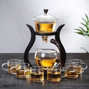 Juego de té de vidrio resistente al calor, tazón de tapa giratoria con dibujo de agua magnética, tetera semiautomática, tetera de goteo de Kung Fu Perezoso - Product Image 1