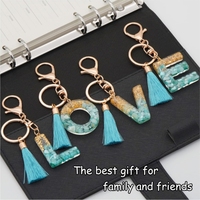 Vente en gros pendentif porte-clés sac à main bleu Capital 26 lettres mot anglais gland porte-clés résine Flash acrylique pendentif
