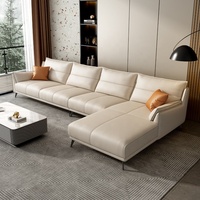 Canapé d'angle moderne en cuir véritable crème avec coussins confortables pour un salon luxueux
