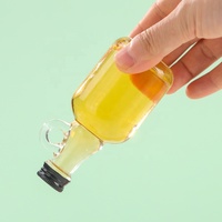 Mini bouteille de sirop en verre transparente de 40ml 50ml avec poignée en boucle pour le stockage de miel de sirop d'érable