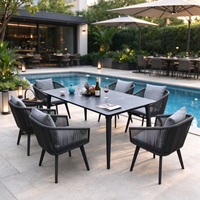 Ensemble de salle à manger d'extérieur en aluminium avec fauteuils en corde tressée à la main, table en pierre frittée, mobilier de patio