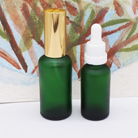 Bouteilles vides d'huile capillaire en verre cylindrique vert foncé de 1oz pour sérum et huile essentielle