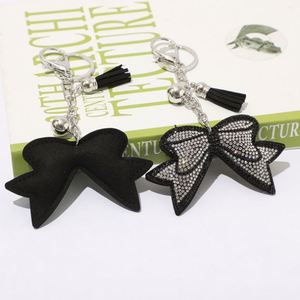 Porte-clés <span class=keywords><strong>en</strong></span> cristal <span class=keywords><strong>en</strong></span> forme de nœud papillon avec motif léopard, avec pompon et anneau <span class=keywords><strong>en</strong></span> métal, <span class=keywords><strong>prix</strong></span> de gros, accessoires pour clés - Product Image 1