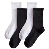 Chaussettes de sport en coton tricotées unies antidérapantes et absorbantes pour hommes, collection automne-hiver, coloris noir et blanc, modèle jeune et très vendu