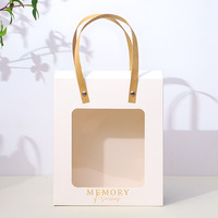 Nouveau sac cadeau transparent haut de gamme en papier, idéal pour la Saint-Valentin, les anniversaires et les cadeaux.
