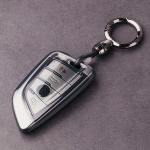 Housse de clé pour <span class=keywords><strong>BMW</strong></span> avec <span class=keywords><strong>porte</strong></span>-clés en cuir, pour <span class=keywords><strong>BMW</strong></span> Série 2 5 6 7 X1 X2 X3 X5 X6 X7, <span class=keywords><strong>porte</strong></span>-clés en TPU souple de qualité supérieure - Product Image 1