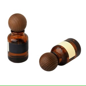 Venta al por Mayor de Botellas de Vidrio Vacías de 30 ml, 50 ml y 100 ml, Botellas de Perfume Cilíndricas de Vidrio Ámbar, Botellas de Vidrio para Cosméticos con Tapa de Bola de Madera - Product Image 1