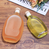 Bouteille d'eau en verre de forme spéciale 250ml 500ml 750ml avec bouchon personnalisable, impression sablée, logo, conteneur vide pour jus et boissons