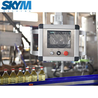 Machine de remplissage d'huile à piston linéaire entièrement automatique pour bouteilles en plastique SKYM