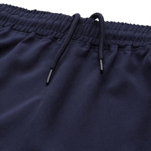 Ensemble de survêtement blanc personnalisé avec fermeture éclair intégrale, veste de survêtement à col montant et fermeture éclair contrastante orange, et pantalon de jogging - Product Image 3
