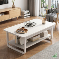 Table basse tout blanche avec structure en acier, style classique européen pour salon, table centrale à 2 niveaux pour magazines et décorations