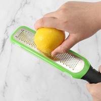 Handmatige 304 roestvrijstalen kaasrasp, groente- en fruitschiller, beschermhoes, fruitsnijder, schil- en schraperschaaf voor citroen