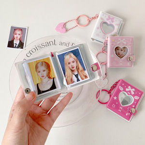 Álbum de fotos con cubierta de PVC de 2 pulgadas con diseño de nudo de mariposa y corazón hueco, colgante de llavero boutique, álbum de almacenamiento de pegatinas para estudiantes y mujeres - Product Image 4