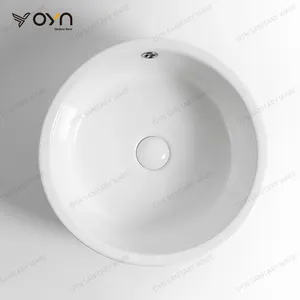 Lavabo de comptoir rond en quartz suspendu Lavabo en céramique au design moderne