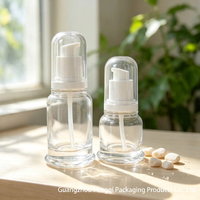Flacon pompe rond en verre soufflé transparent 30ml 50ml avec surface givrée pour emballage de sérum cosmétique, huile essentielle, soin de la peau