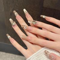 Faux ongles à presser pour femmes, couleur nude champagne, forme cercueil, motif léopard perlé, nœud en cristal surdimensionné, pour femme élégante et luxueuse