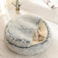 Vente en gros d'usine OEM lit pour chat grotte lit rond en peluche moelleux à capuche pour chien beignet auto-chaud maison pour animaux de compagnie lit apaisant nid de chenil de couchage