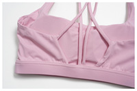 Soutien-gorge de yoga à bretelles croisées et dos élégant avec coussinets amovibles, ultra-doux et respectueux de la peau, haut de fitness très élastique pour femme