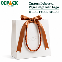 Sacs en papier kraft blanc personnalisés avec logo Ccpack, poignée tressée de luxe, ruban à nœud, emballage cadeau pour bijoux, boutique de mode
