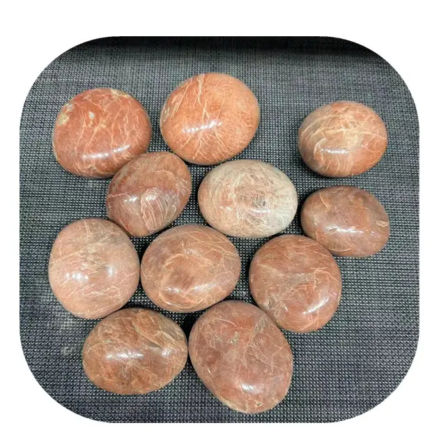 Venta al por mayor natural pulido melocotón piedra lunar Palma cristales piedras curativas para la venta