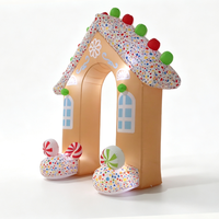 Arche gonflable en forme de maison de pain d'épices de Noël avec des bâtons de sucre et des sucettes pour la décoration d'entrée d'événements festifs