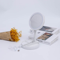 Miroir de maquillage pliable en gros avec éclairage LED, miroir de vanité à écran tactile intelligent, miroir cosmétique rond pour coiffeuse