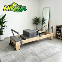 Appareil de Pilates Reformer à ressorts réglables avec lit en bois pour la maison et les studios de yoga