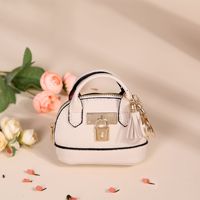 Porte-monnaie ovale mini écologique et mignon, porte-clés en cuir PU souple de haute qualité, pochette de rangement pour rouge à lèvres et clés de voiture