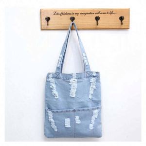 Sac à bandoulière en jean imperméable en polyester, grande capacité, fermeture éclair, design spécial, sac fourre-tout en jean pour femme - Product Image 1
